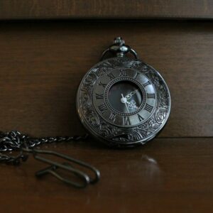 An antique pocket watch, marking the moment a question is asked